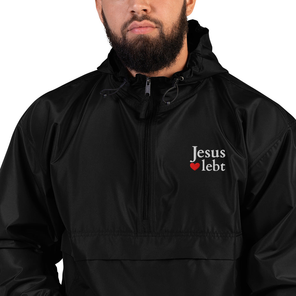 Jesus lebt - Bestickte, verstaubare Champion-Jacke - dunkles Design - DE faith design by The Light of Life