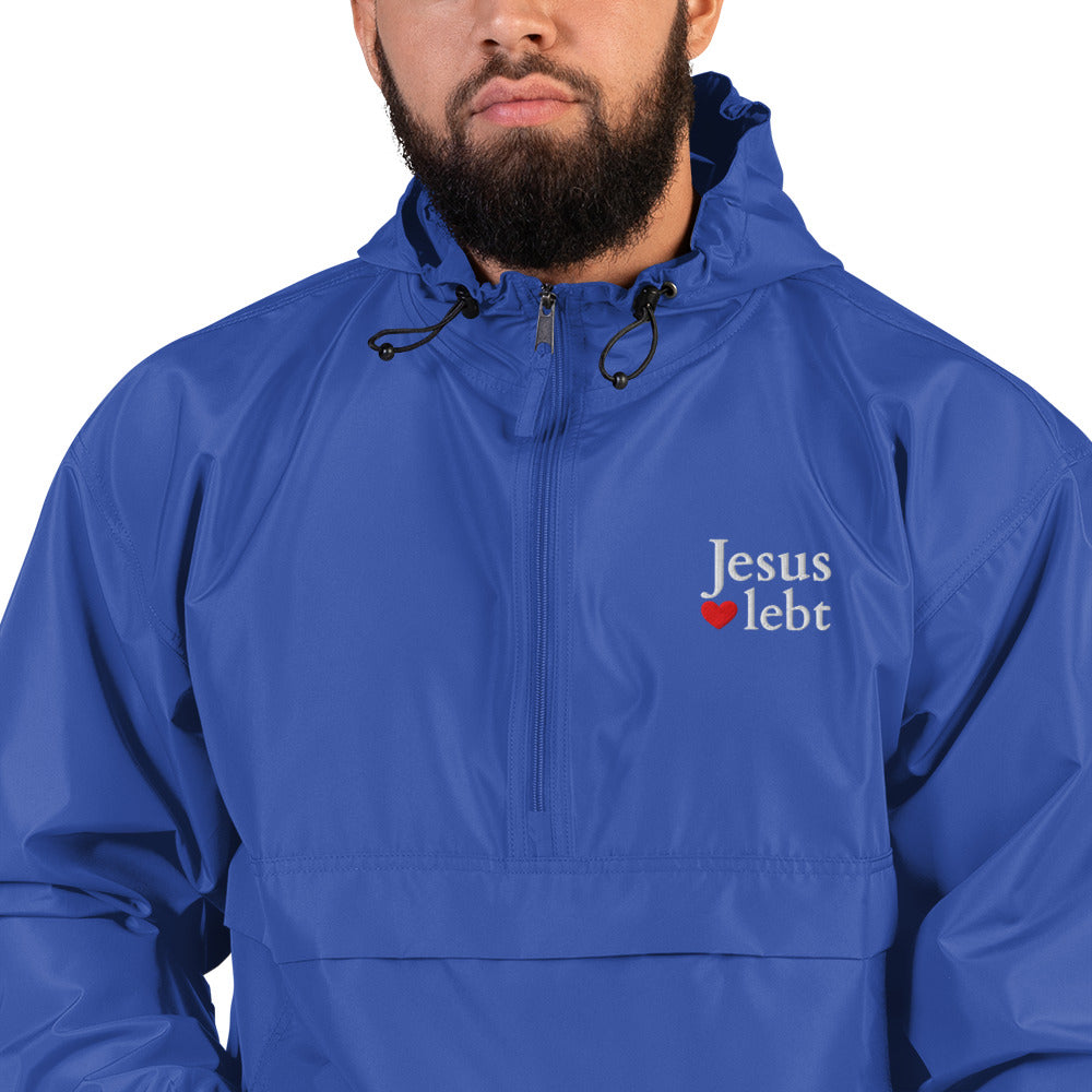 Jesus lebt - Bestickte, verstaubare Champion-Jacke - dunkles Design - DE faith design by The Light of Life